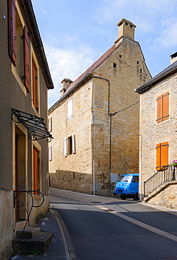 An old French delivery van poking around a corner in a sleepy French town, France, Europe