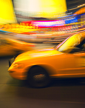 Traditional yellow taxi at night, New York City, United States of America, North America