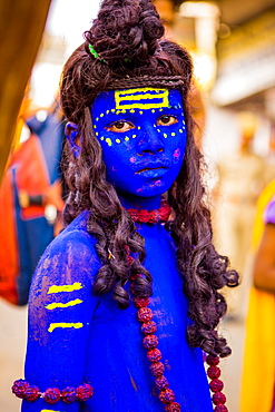 Painted boy at the Pushkar Camel Fair, Pushkar, Rajasthan, India, Asia