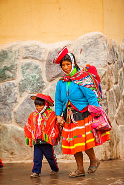 Traditional Peruvian Incan woman and her son, Ollantaytambo, Peru, South America