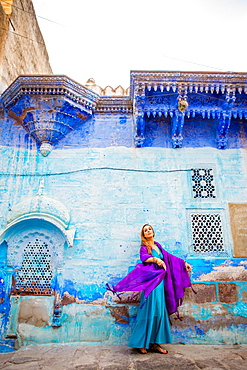 Laura Grier stands in the blue streets of Jodhpur, the Blue City, Rajasthan, India, Asia