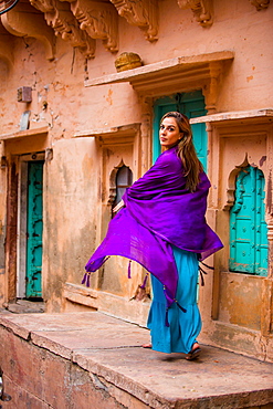 Laura Grier walking through the old streets in Jodhpur, the Blue City, Rajasthan, India, Asia