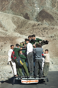 Children overload a local bus to get to school , Gilgit-Baltistan, Pakistan, Asia