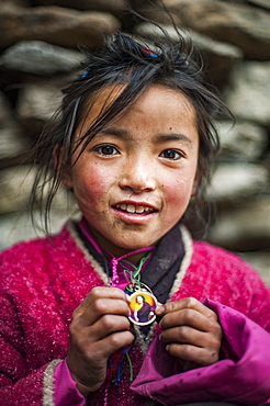 A little Buddhist girl in the Tsum Valley, Manaslu region, Nepal, Asia