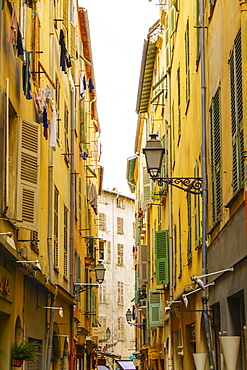 Narrow street in the Old Town, Vieille Ville, Nice, Alpes-Maritimes, Cote d'Azur, Provence, French Riviera, France, Mediterranean, Europe