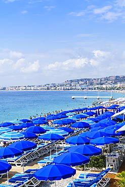 Blue parasols on the beach, Promenade des Anglais, Nice, Alpes Maritimes, Cote d'Azur, Provence, France, Mediterranean, Europe