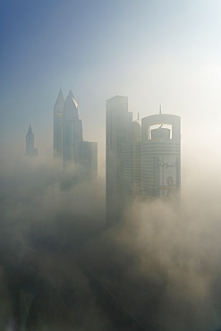 A foggy morning shrouds skyscrapers in Dubai, United Arab Emirates, Middle East