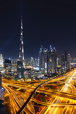 Dubai skyline and Sheikh Zayed Road Interchange by night, Dubai, United Arab Emirates, Middle East