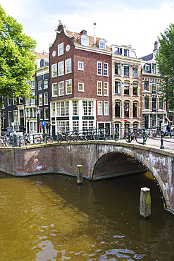 Old gabled buildings by a bridge on Keizersgracht, Amsterdam, North Holland, The Netherlands, Europe