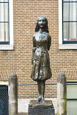 Statue of Anne Frank outside Westerkerk Church, Amsterdam, North Holland, The Netherlands, Europe