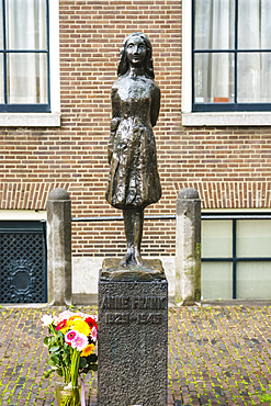 Statue of Anne Frank outside Westerkerk Church, Amsterdam, North Holland, The Netherlands, Europe