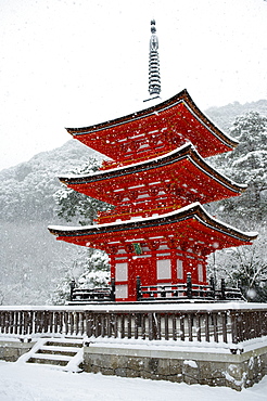 Snow falling on small red pagoda, Kiyomizu-dera Temple, UNESCO World Heritage Site, Kyoto, Japan, Asia