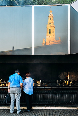 Religious pilgrims light candles at Sanctuary of Fatima (Basilica of Our Lady of Fatima), Portugal, Europe