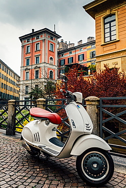 Italian Vespa with typical Milan-style architecture, Milan, Lombardy, Italy, Europe