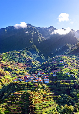 Elevated view of village and tree covered hills and mountains near Ponta Delgada, Madeira, Portugal, Atlantic, Europe