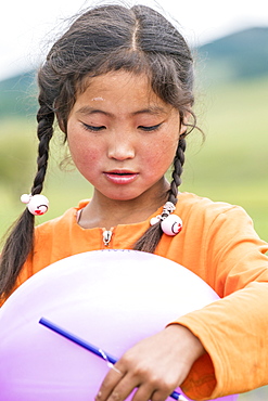 Portrait of a Mongolian Nomadic girl with braids, North Hangay province, Mongolia, Central Asia, Asia