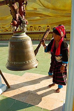 Buddhist bell and devotee, Bagan (Pagan), Myanmar (Burma), Asia