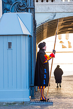 A Pontifical Swiss guard in ceremonial uniform at St. Peter's Basilica, Vatican City, Rome, Lazio, Italy, Europe