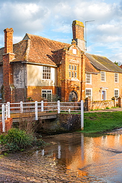 Fifteenth century Ye Olde River House dating from 1490 reflected in the ford, in the village of Kersey, Suffolk, England, United Kingdom, Europe