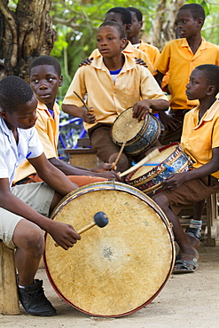 A group of young men playing the drums in Ghana, West Africa, Africa