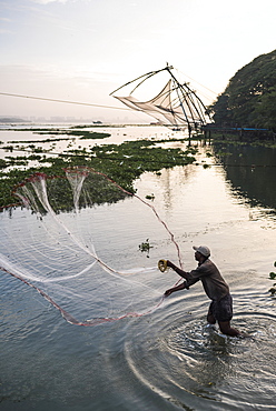 Traditional Chinese fishing nets at sunrise, Fort Kochi (Cochin), Kerala, India, Asia