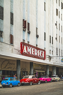 Old vintage cars parked outside Teatro America, La Habana (Havana), Cuba, West Indies, Caribbean, Central America