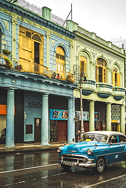 Turquoise vintage taxi in the rain, La Habana (Havana), Cuba, West Indies, Caribbean, Central America