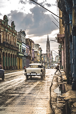 Typical street in La Habana and cathedral in the distance in rain, Havana, Cuba, West Indies, Caribbean, Central America