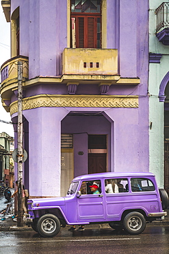 Pink building and pink vintage car in La Habana (Havana), Cuba, West Indies, Caribbean, Central America