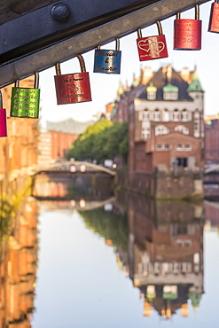 Wasserschloss building at the historical warehouse complex (Speicherstadt) seen from Poggenmuehlenbruecke at sunrise, Hamburg, Germany, Europe