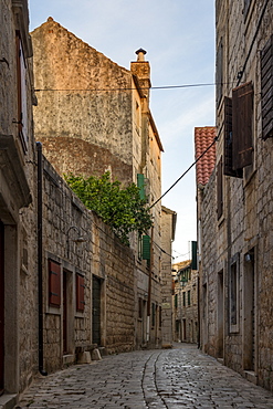 Narrow street in the old town of Stari Grad on Hvar Island at first sunlight, Hvar, Croatia, Europe