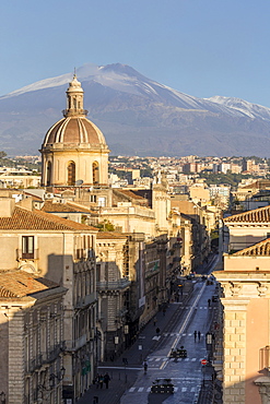 The cupola of Saint Michael church and Mount Etna in the background, Catania, Sicily, Italy, Europe