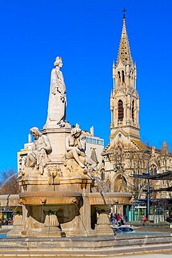 The Pradier Fountain and Saint Perpetue Church behind, Nimes, Gard, Occitania, France, Europe