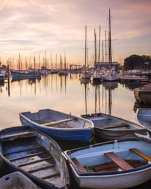 Early morning light upon the tenders, yachts and fishing boats at the Quay, Lymington, Hampshire, England, United Kingdom, Europe