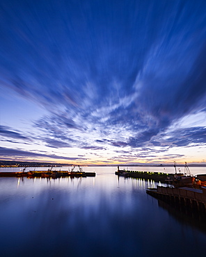 Dawn twilight across the harbour of the fishing port of Newlyn in Cornwall, England, United Kingdom, Europe