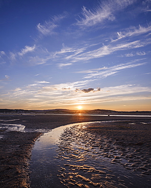 Looking at the setting sun across the Exe estuary towards Starcross from Exmouth, Devon, England, United Kingdom, Europe