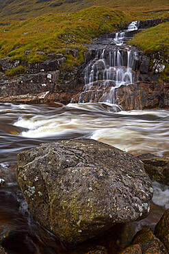 Waterfall cascading in to the River Etive, Glen Etive, Argyll and Bute, Scotland, United Kingdom, Europe