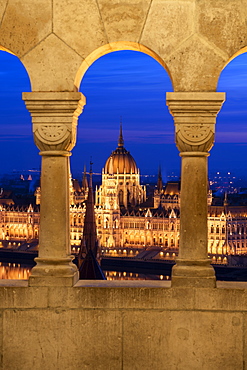 The view of the Hungarian Parliament at night, from the columns of the Fisherman's Bastion, UNESCO World Heritage Site, Budapest, Hungary, Europe