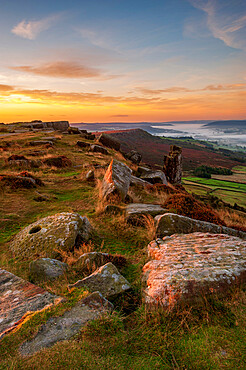 Sunrise at Curbar Edge with mist in valley, Peak District, Derbyshire, England, United Kingdom, Europe