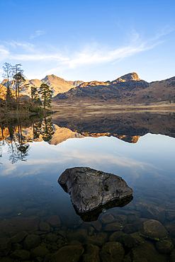 Blea Tarn with mirror conditions, spring, Lake District National Park Cumbria