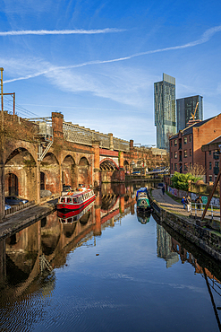 Castlefield basin with red barge and view of Beetham Tower, Manchester
