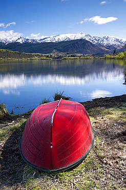 Snow capped mountains reflected in Lake Hayes, Wakatipu Basin in Central Otago, South Island, New Zealand, Pacific