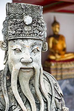 Detail of stone statue of guard and sitting Buddha in Wat Pho (Wat Phra Chetuphon) (Temple of the Reclining Buddha), Bangkok, Thailand, Southeast Asia, Asia