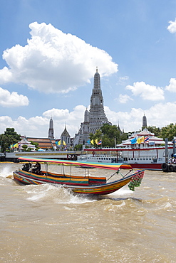 Wat Arun (Temple of Dawn), Ruea Hang Yao (long tail boat) on the Chao Phraya River, at sunset, Bangkok, Thailand, Southeast Asia, Asia