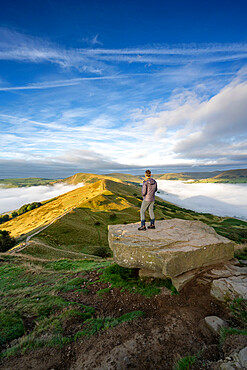 A walker admiring the view across The Great Ridge and Mam Tor, Peak District, Derbyshire, England, United Kingdom, Europe