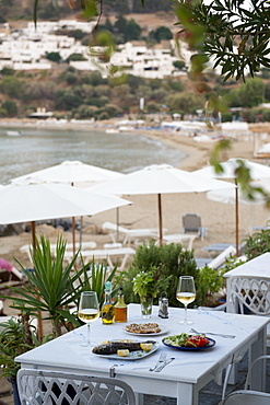 Fish and salad served at a Greek restaurant by the sea, Lindos, Rhodes, Dodecanese, Greek Islands, Greece, Europe