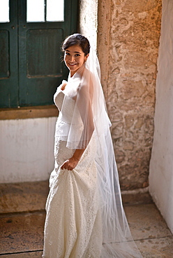 Hispanic bride getting ready on her wedding day