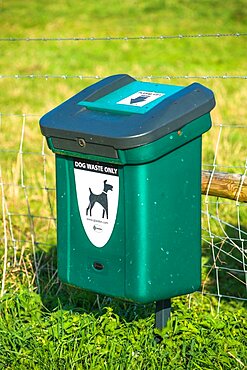 Green Dog Waste Bin at Wicken Fen, Cambridgeshire, East of England, England, UK