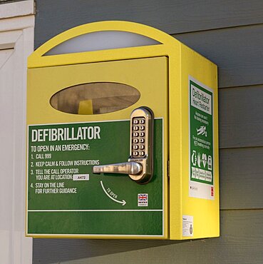 Ventnor, Isle of Wight, England, UK, , A defibrillator machine and security locking device mounted on a wall close to the seafront in this English resort