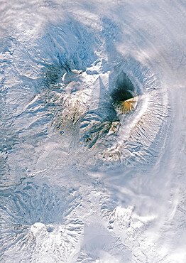 Color satellite image of Volcanoes on Kamchatka Peninsula, Russia. Klyuchevskaya, to the right, the tallest and most active volcano on the peninsula